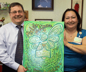 Dr. Raul Mena, Oncologist, and Veronica Hudson, Clinical Research Coordinator