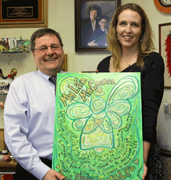 Dr. Raul Mena, Oncologist, and Laurel Latto, DonnaBellas Angels Artist